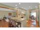 Kitchen featuring breakfast bar, hardwood floors, and open layout at 16 Cattail Ln, Brownsburg, IN 46112