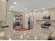 Open kitchen with stainless appliances and breakfast bar at 16 Cattail Ln, Brownsburg, IN 46112