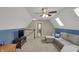 Bonus room features plush carpeting, a ceiling fan, comfortable seating, and natural light at 16 Cattail Ln, Brownsburg, IN 46112
