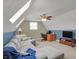 Upstairs living area features plush carpeting, a ceiling fan, and a comfortable sectional sofa at 16 Cattail Ln, Brownsburg, IN 46112