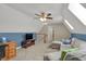 Upstairs bonus room features plush carpeting, a ceiling fan, and a comfortable sectional sofa at 16 Cattail Ln, Brownsburg, IN 46112