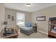 Office features a desk, gray chaise lounge, and window at 16 Cattail Ln, Brownsburg, IN 46112