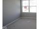 Bright new construction bedroom with a large window and neutral walls at 16830 Silo Meadows Dr, Noblesville, IN 46060