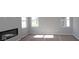 Spacious living room featuring a modern electric fireplace and bright windows at 16830 Silo Meadows Dr, Noblesville, IN 46060