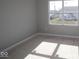 Bright, blank room ready for personalization, featuring a large window at 16830 Silo Meadows Dr, Noblesville, IN 46060