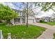 Landscaped front yard features beautiful green grass and a well maintained driveway with a basketball hoop at 18980 Bladed Mills Dr, Noblesville, IN 46062
