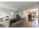 Open-concept living room leading to a dining and kitchen area at 18980 Bladed Mills Dr, Noblesville, IN 46062