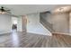 An open-concept living room and staircase features stylish flooring and plenty of space for entertaining at 18980 Bladed Mills Dr, Noblesville, IN 46062