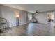 Bright and spacious living room with wood-look floors and a large window to let in natural light at 18980 Bladed Mills Dr, Noblesville, IN 46062