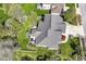 Aerial perspective of a large, well-maintained property with lush landscaping, patio, and mature trees at 19311 Morrison Way, Noblesville, IN 46060