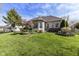 Large backyard features well-manicured lawn, lush garden beds, and ample space for outdoor enjoyment at 19311 Morrison Way, Noblesville, IN 46060