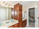 Inviting bathroom with double sinks, wooden cabinets, and neutral tones, creating a spa-like atmosphere at 19311 Morrison Way, Noblesville, IN 46060
