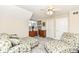 Relaxing bedroom area with plush seating, a ceiling fan, and neutral decor for a calming atmosphere at 19311 Morrison Way, Noblesville, IN 46060
