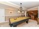 Billiard room in the finished basement with striped walls, a pool table, and custom lighting at 19311 Morrison Way, Noblesville, IN 46060