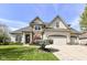 Attractive single-Gathering home with a well-kept lawn, mature landscaping, and a three-car garage at 19311 Morrison Way, Noblesville, IN 46060