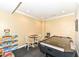 Ample game room with an air hockey table and checker set for fun gatherings at 19311 Morrison Way, Noblesville, IN 46060