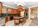 Well-equipped kitchen with a large island, granite counters, custom cabinets, and modern appliances at 19311 Morrison Way, Noblesville, IN 46060