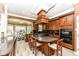 Gourmet kitchen with island, granite countertops, custom cabinets, and modern stainless appliances at 19311 Morrison Way, Noblesville, IN 46060