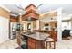 Spacious kitchen with stainless appliances, marble flooring, and central island at 19311 Morrison Way, Noblesville, IN 46060