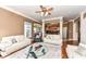 Open-concept living room featuring hardwood floors, a fireplace and adjacent kitchen at 19311 Morrison Way, Noblesville, IN 46060