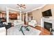 Spacious living room featuring hardwood floors, fireplace and easy access to the kitchen at 19311 Morrison Way, Noblesville, IN 46060