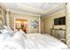 Bright main bedroom showcasing tray ceiling, decorative columns, and ensuite bath at 19311 Morrison Way, Noblesville, IN 46060