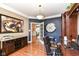 Spacious home office with hardwood floors, custom built-in shelving, and stylish decor at 19311 Morrison Way, Noblesville, IN 46060