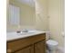 Half bathroom featuring a pedestal sink, large mirror, and neutral decor at 2020 Tourmaline Dr, Westfield, IN 46074