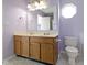 Bathroom with double vanity, tile floors, and an octagon shaped window at 2020 Tourmaline Dr, Westfield, IN 46074