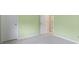 Bedroom with light green walls, white trim, doors and light-colored carpet at 2020 Tourmaline Dr, Westfield, IN 46074