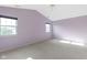 Spacious bedroom with neutral carpet and lavender colored walls and two large windows at 2020 Tourmaline Dr, Westfield, IN 46074