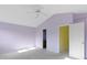 Bedroom with neutral carpet, a ceiling fan, and lavender walls with a connected bath and closet at 2020 Tourmaline Dr, Westfield, IN 46074