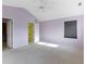 Spacious bedroom with neutral carpet and lavender colored walls with a connected bath and closet at 2020 Tourmaline Dr, Westfield, IN 46074