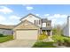 Charming two-story home with a brick-accented garage and well-maintained lawn at 2020 Tourmaline Dr, Westfield, IN 46074