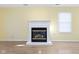 Elegant fireplace with a white mantle, hardwood floors, and a cozy ambiance at 2020 Tourmaline Dr, Westfield, IN 46074