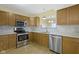 A well-lit kitchen features stainless steel appliances and marble backsplash at 2020 Tourmaline Dr, Westfield, IN 46074