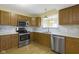 A well-lit kitchen features stainless steel appliances and marble backsplash at 2020 Tourmaline Dr, Westfield, IN 46074