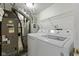 Finished laundry room with appliances, storage space, and utility connections at 2020 Tourmaline Dr, Westfield, IN 46074