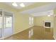 Open concept living room with tile flooring, fireplace and glass doors to porch at 2020 Tourmaline Dr, Westfield, IN 46074