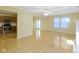 Spacious living room with hardwood floors, ceiling fan, and sliding glass doors to the backyard at 2020 Tourmaline Dr, Westfield, IN 46074
