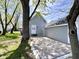 View of the backyard with patio, grass and trees at 2022 Indiana Ave, Columbus, IN 47201