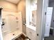 Bright bathroom featuring a shower stall, white vanity, and wood-look flooring at 2022 Indiana Ave, Columbus, IN 47201