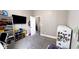 Neutral toned bedroom with tv and storage shelves for toys at 2022 Indiana Ave, Columbus, IN 47201