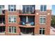 View of a well-decorated balcony with outdoor seating and charming brick exterior at 20971 Shoreline Ct # 305, Noblesville, IN 46062
