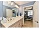 Well-lit bathroom vanity area features spacious countertop and modern lighting at 20971 Shoreline Ct # 305, Noblesville, IN 46062