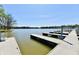 Picturesque lakeside view of dock with boat slips, ideal for boating and waterfront living at 20971 Shoreline Ct # 305, Noblesville, IN 46062