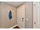 Inviting entryway with coat rack and neutral walls, leading into the home at 20971 Shoreline Ct # 305, Noblesville, IN 46062