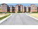 Attractive brick building with multiple stories and balconies on a sunny day at 20971 Shoreline Ct # 305, Noblesville, IN 46062