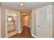 Hallway with hardwood floors leading to bathroom and other rooms at 20971 Shoreline Ct # 305, Noblesville, IN 46062