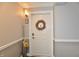 Front door decorated with a decorative wreath and a bird statue next to it at 20971 Shoreline Ct # 305, Noblesville, IN 46062